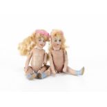Two French Lilliputian all-bisque dolls' house dolls, with blue painted eyes, original blonde mohair