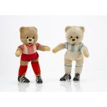 Two Schuco bigo-bello teddy bear footballers, with beige mohair, black and white plastic eyes, black