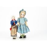 Two French dolls, an Eden bebe with fixed blue glass eyes, closed mouth, pierced ears, blonde mohair