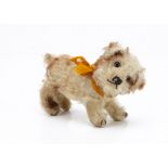 A Steiff standing Molly dog late 1920s, with white and brown tipped mohair, brown and black glass