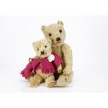 Two 1930s Chiltern-type teddy bears, the largest with golden mohair, orange and black glass eyes,
