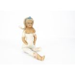 An English poured pale wax shoulder-head doll, with blue glass eyes, inserted blonde mohair wig,