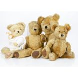 Four post-war British teddy bears, all mohair with swivel heads, plastic eyes and jointed limbs,