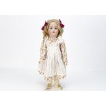 A Simon & Halbig for Kämmer & Reinhardt child doll, with blue sleeping eyes, blonde mohair wig,