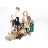 Various dolls, a recent Prick Willow pottery doll --19 ½in. (49.5cm.) high; two papier-