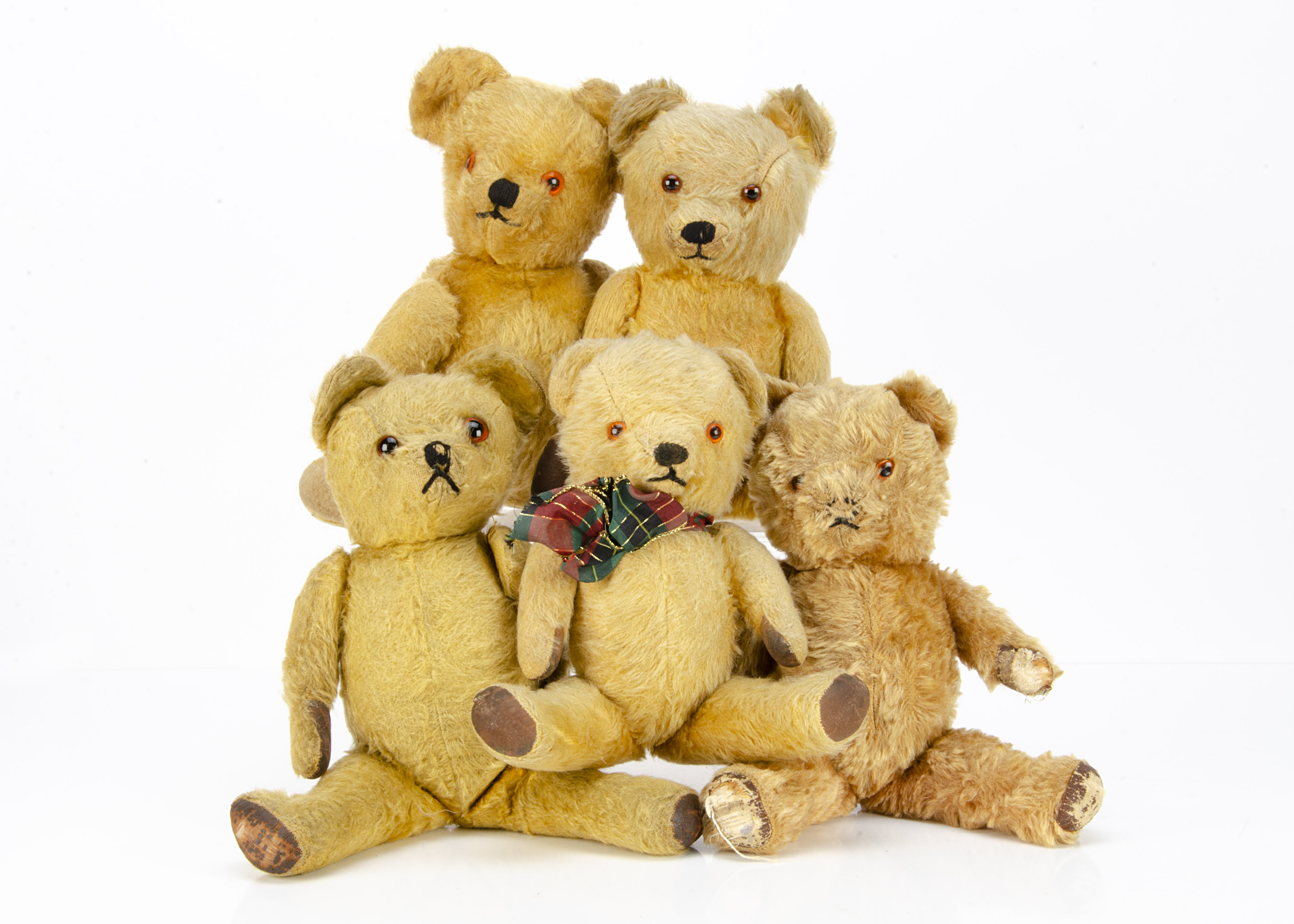 Five post-war British teddy bears, two with keywind musical mechanisms --15 ½in. (39cm.) height of