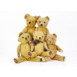 Five post-war British teddy bears, two with keywind musical mechanisms --15 ½in. (39cm.) height of