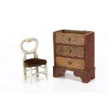 An English first half of the 19th century dolls' house chest of drawers in the style of Bubb, with