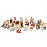 Various bisque Christmas cake decorations, twenty-three including Father Christmases and carol