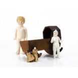 An early English wooden dolls' house cradle, with bowed rockers --4 ¾in. (12cm.) high; a china