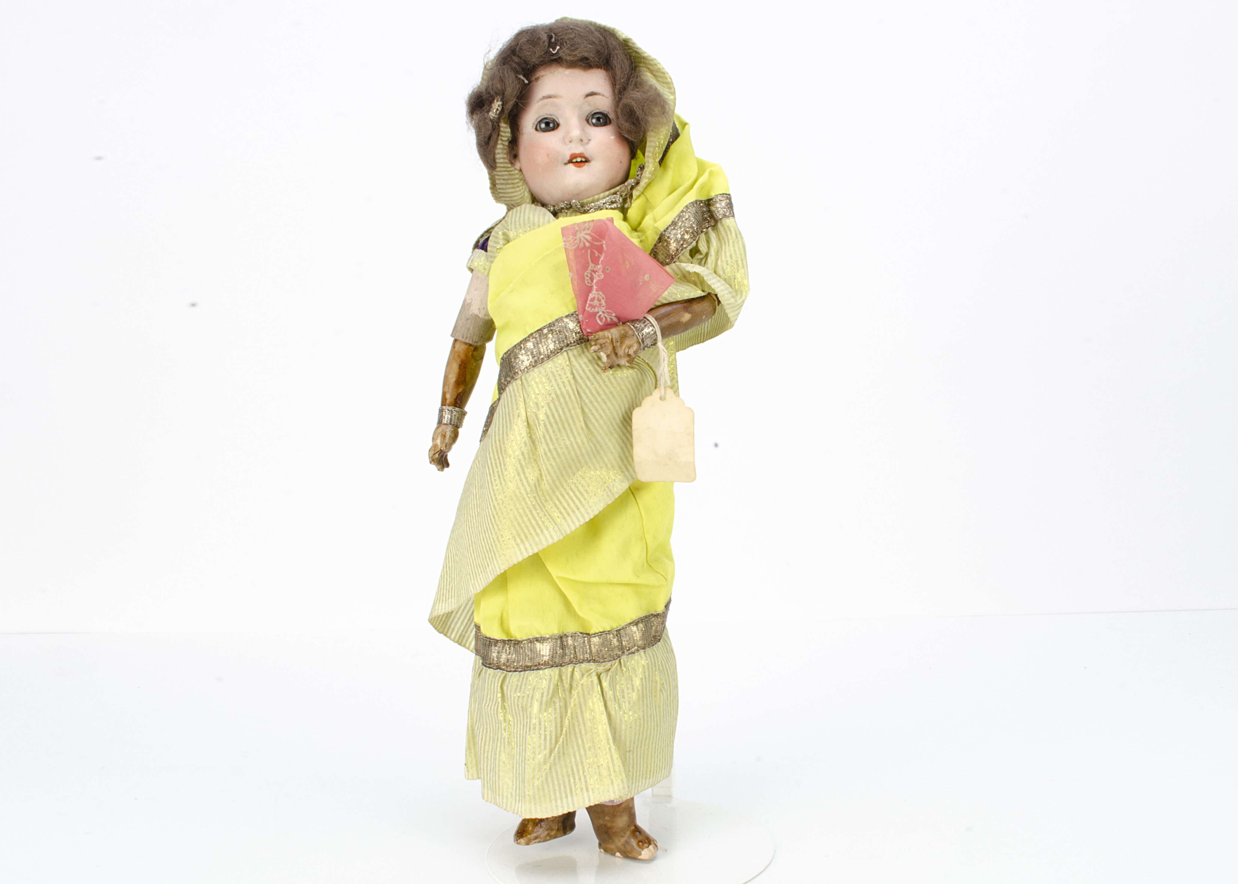 A Welsh & Company 201 child doll dressed as a Burmese lady, with blue glass eyes, brown mohair