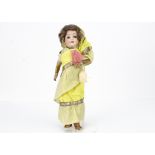 A Welsh & Company 201 child doll dressed as a Burmese lady, with blue glass eyes, brown mohair