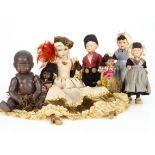 A Le Minor Dolls Petitcollin celluloid black baby, with brown painted eyes, broad nose and full