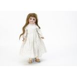 A DEP child doll, probably Simon & Halbig head with lashed blue glass eyes, long brown hair wig,