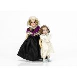 Two small German bisque headed dolls, one marked 435 with blue sleeping eyes, blonde mohair wig,