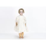 A Simon & Halbig 1079 DEP child doll, with brown sleeping eyes, blonde mohair wig, pierced ears,