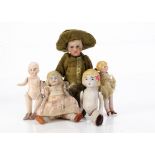 Five all-bisque dolls' house dolls, one with blonde moulded hair, jointed limbs with painted shoes