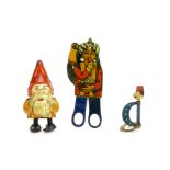 Three German lithographed tinplate novelty toys, a gnome or Father Christmas ramp toy --5 ½in. (