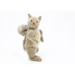 A 1920s German jointed grey squirrel, with grey and white mohair, black glass eyes, light brown