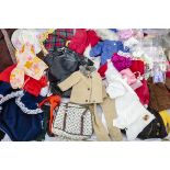 A quantity of Sindy clothes, including Shopping-in-the Rain, Winter Holiday coat, a wedding dress