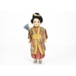 A small Armand Marseille Oriental child doll, with dark glass slanted almond eyes, black mohair wig,