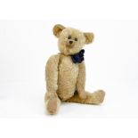 'Squint' a German teddy bear 1910-20s, with blonde mohair, closely set black boot button eyes,