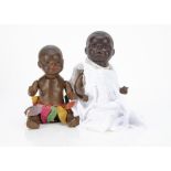 Two black baby dolls, an Ernst Heubach bisque headed 399 with dark sleeping eyes, broad nose, full