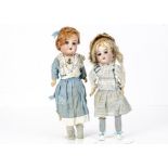 Two Recknagel 1909 DEP child dolls, one fixed blue glass eyes and the other with dark sleeping eyes,