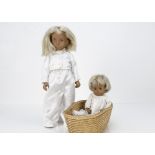 A Trendon Sasha doll, with blonde hair and home-made white trouser suit; and a blonde baby in