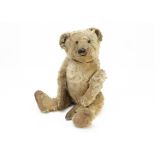 An early German teddy bear circa 1910, possibly or similar to Strunz with blonde mohair, black