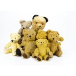 Seven post-war teddy bears, a large cotton plush Sooty type teddy bear with swivel head and