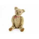 'Stargazer' a 1920s teddy bear, with blonde mohair, orange and black glass eyes, pronounced