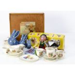 Children's tea set and graduated pottery bunnies, a silvered pottery Art Deco tea pot; a teapot,