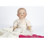 An Armand Marseille 351 baby doll, with blue sleeping eyes, blonde painted hair, bent-limbed