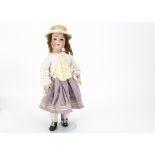 An Armand Marseille 390 child doll, with lashed blue sleeping eyes, brown mohair wig, jointed
