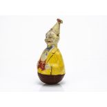 A composition roly-poly clown 1930s, with smiling face, conical hat and yellow jacket, internal