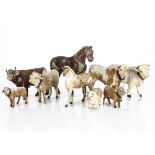 Nine skin covered farm yard animals, two bullocks --5 ½in. (14cm.) long, a pony and a pig, smaller