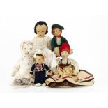 Various cloth dolls a Dean's Rag Book school girl with painted stiffened cloth face and label on