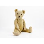 'Herr Ratselhaft' a Bing teddy bear 1920s, with golden mohair, replaced glass eyes, pronounced