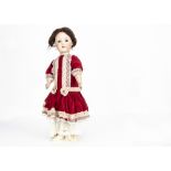 A German bisque headed walking and talking doll marked 572 HW, with blue sleeping eyes, brown mohair