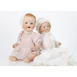 Two German bisque headed character babies, an Ernst Heubach 415 with blue sleeping eyes, blonde