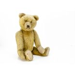 A good quality German teddy bear 1920-30s, with golden mohair, orange and black glass eyes,