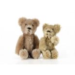 Two miniature Schuco teddy bears 1950s, both with beige mohair, metal pin eyes, black stitched