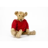 An early American teddy bear circa 1907 with provenance, with golden mohair, black boot button eyes,