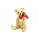 'Baron Crämer' a German teddy bear 1920s, with light golden mohair, clear and black glass eyes,