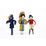 Three German bisque headed Christmas cracker dolls, with blue painted eyes, closed mouth, wired