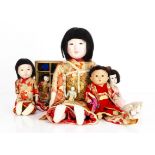 Japanese gofun Ichimatsu dolls, a large girl doll with dark inset eyes, black hair wig and