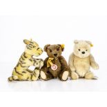 A Steiff yellow tagged Winnie the Pooh, with joints --10in. (25.5cm.) high; a Tigger; and a brown
