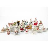 Various bisque Christmas cake decorations, seventeen including a Father Christmas in boats, train,