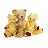 Three post-war Dean's teddy bears, a Childsplay bear with golden mohair, large brown plastic eyes,